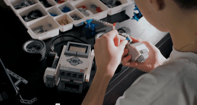 Young engineer building with Legos